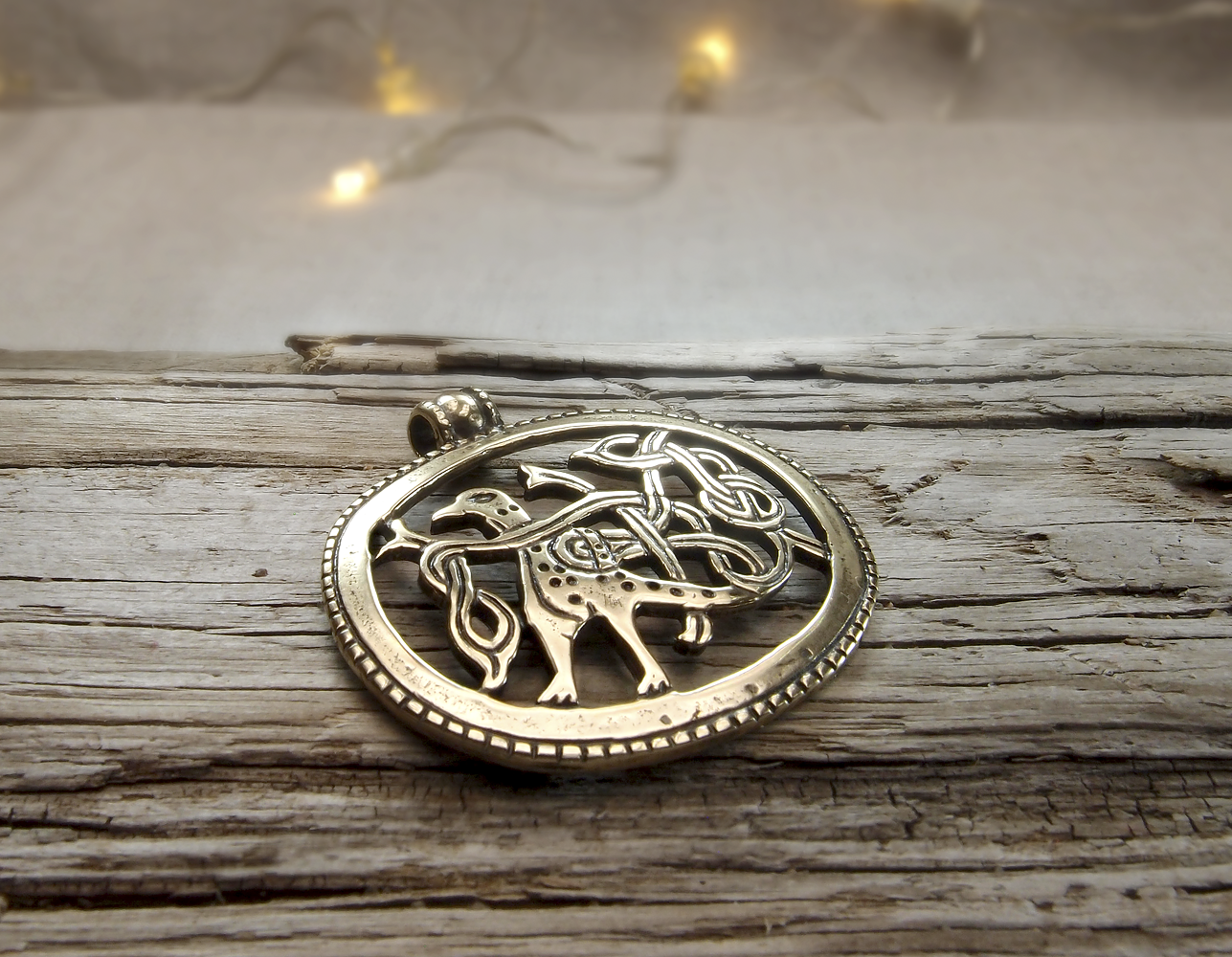 Slotted pendant "Bird with intertwined tail"