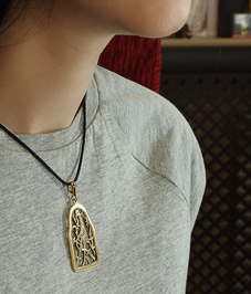 Slotted pendant "Bird with intertwined tail"