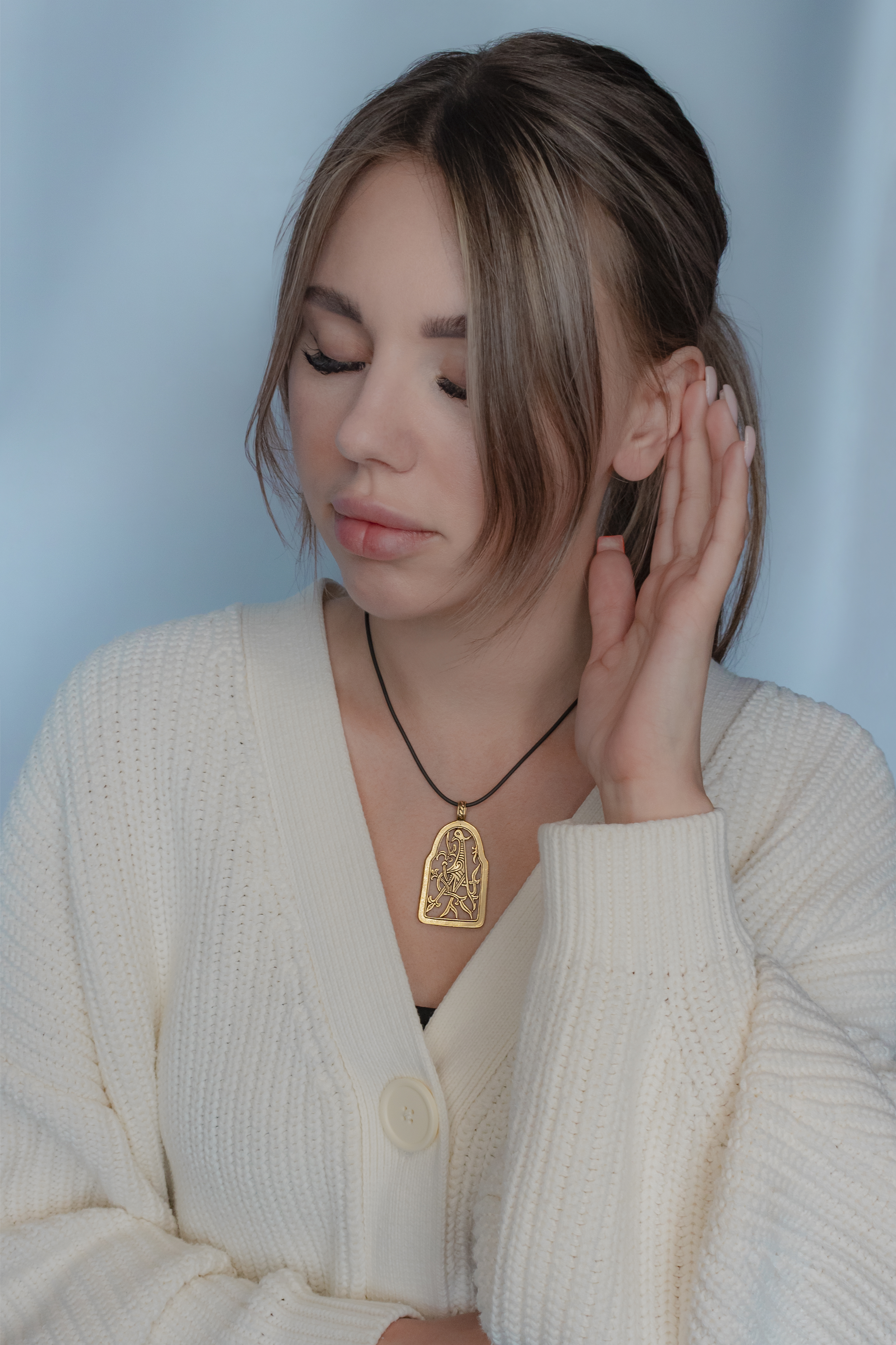 Slotted pendant "Bird with intertwined tail"